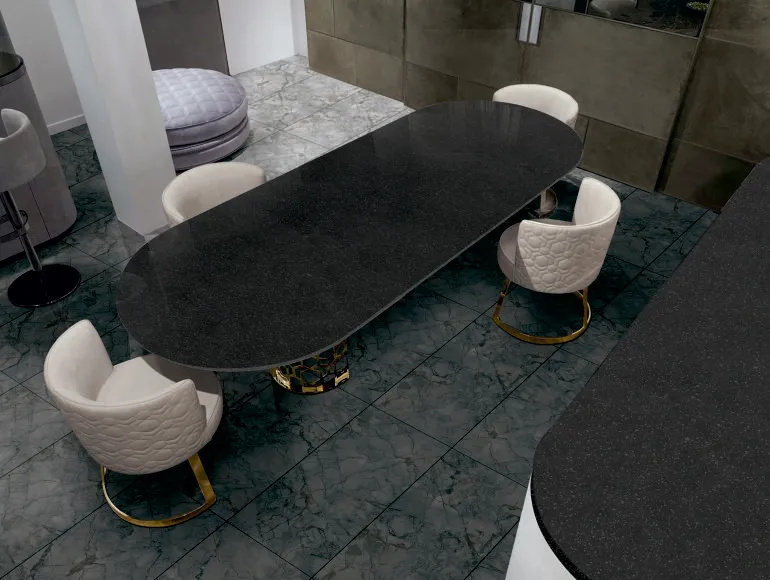 Elegant black countertop design with a glossy finish, featuring a modern dining table setup